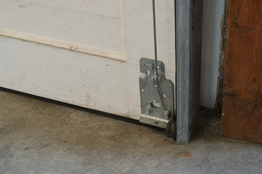 Bottom bracket, lift cable and roller on a garage door in Grand Junction, CO