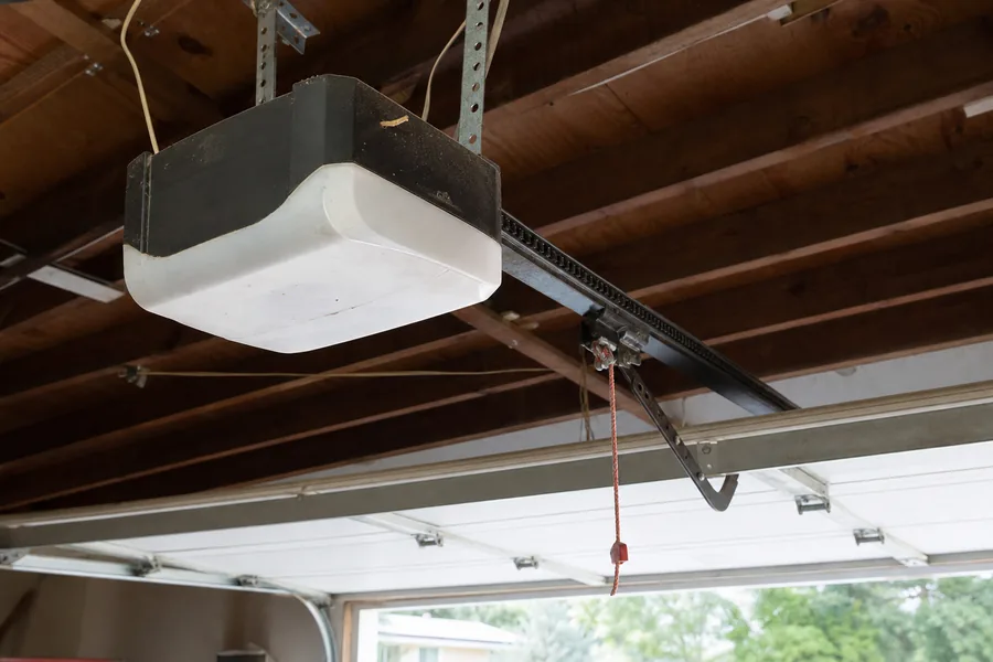 Opener and rail above a two-car door in a ranch home